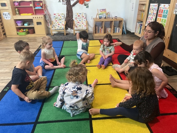 Circle time with a teacher and children