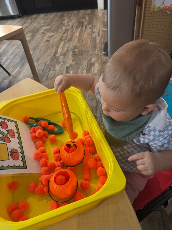 Toddler at a fine-motor sensory play activity